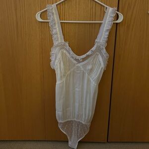 Free People Intimately beautiful bodysuit. Great condition. Size is Medium